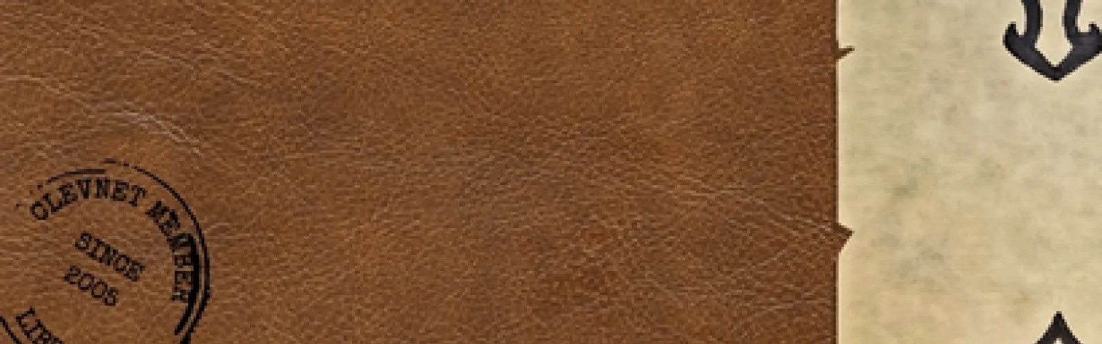 Brown leather background with black stamp and parchment paper in corners